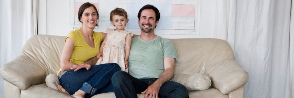 family sitting on couch