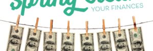 spring clean your finances-$100 bills hanging on a clothesline with clothespins
