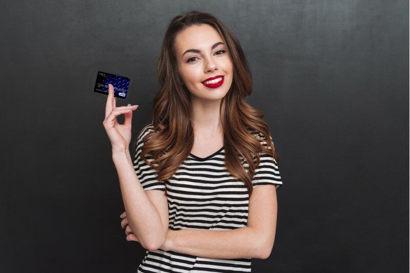 Girl holding PSCU debit card