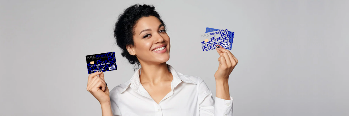 WOMAN HOLDING PSCU CREDIT AND DEBIT CARDS