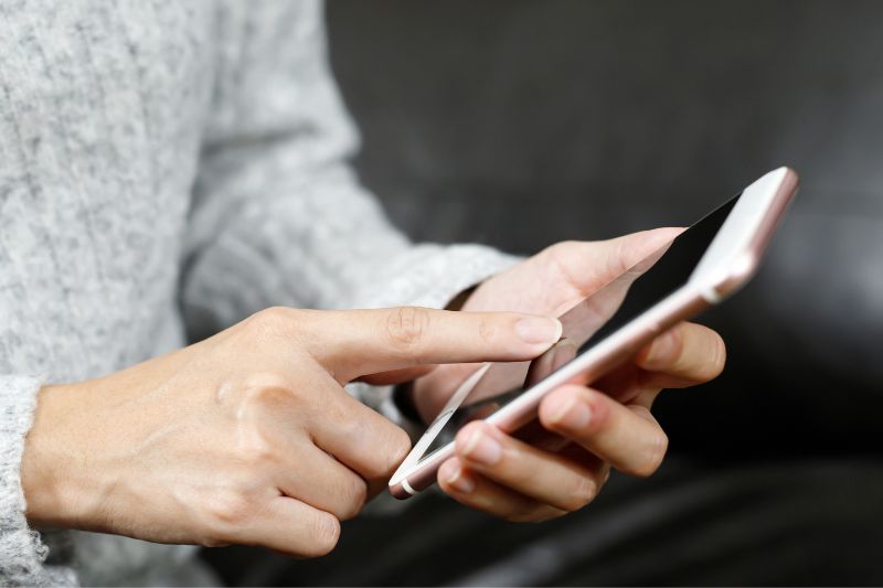 woman holding mobile phone